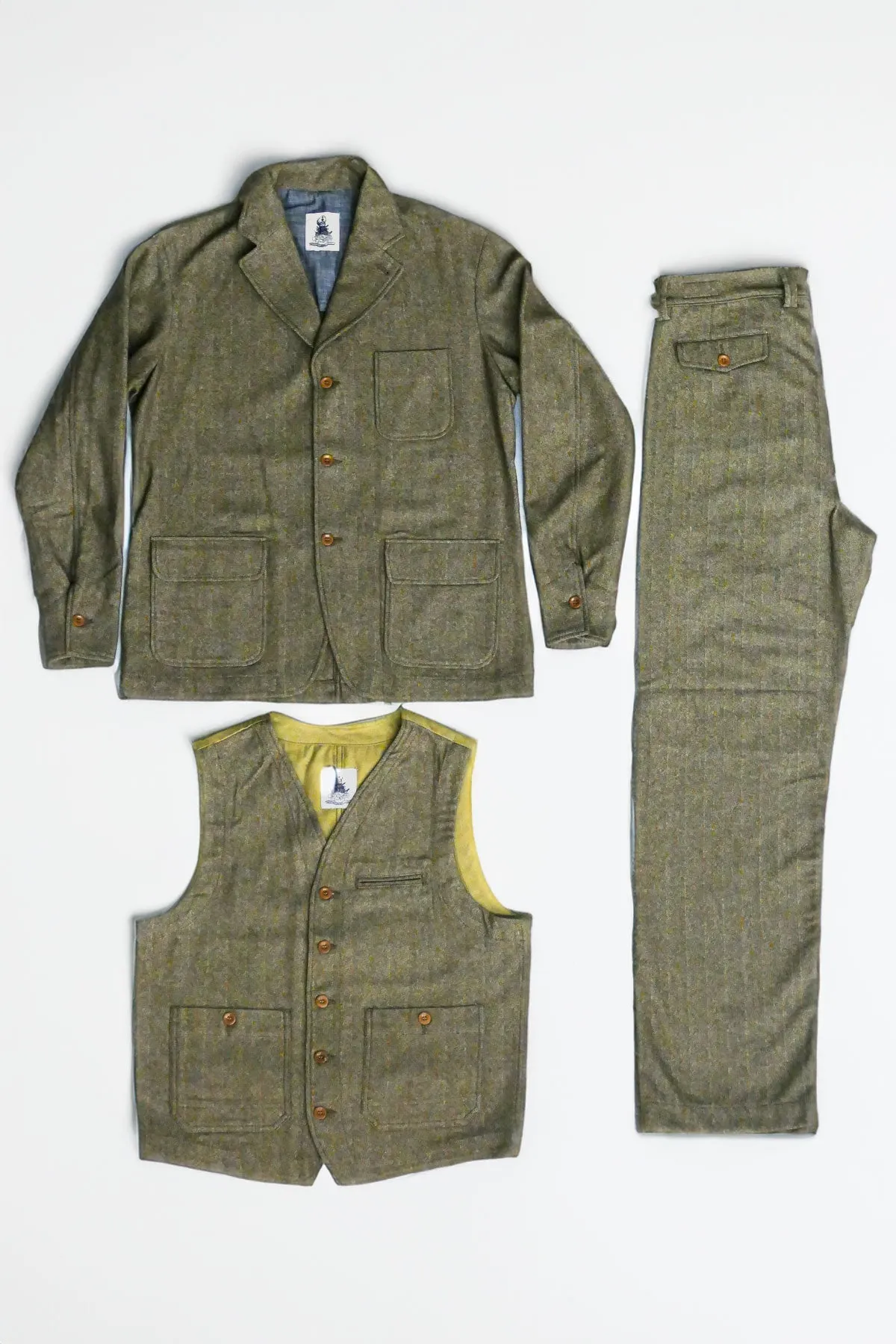 Captain Santors - Herringbone Lawyer Jacket in muted military green with rust stripes